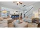 Open-concept living room showcases the kitchen and staircase, great for entertaining at 2981 Sturbridge Rd, Mount Pleasant, SC 29466