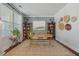Inviting office with built-in bookshelves, decor accents, wooden desk, and stylish rug at 2981 Sturbridge Rd, Mount Pleasant, SC 29466