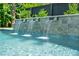 Swimming pool with stone waterfall feature at 2981 Sturbridge Rd, Mount Pleasant, SC 29466
