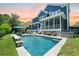 Enjoy the pool and outdoor patio with a barbecue grill, stone accents, and backyard at 2981 Sturbridge Rd, Mount Pleasant, SC 29466