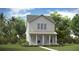 Charming two-story home with a welcoming front porch and well-maintained landscaping at 310 Archar St, Summerville, SC 29486