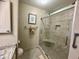 Bathroom featuring large tiled walk-in shower with built-in bench seat at 311 Seascape (Share G), Isle of Palms, SC 29451