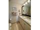 Bathroom with double sink vanity with granite countertop and large framed mirror at 311 Seascape (Share G), Isle of Palms, SC 29451