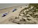 Expansive sandy beach with dunes, umbrellas and boardwalk access at 311 Seascape (Share G), Isle of Palms, SC 29451