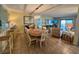 Open concept living and dining area with tile floors and ocean views at 311 Seascape (Share G), Isle of Palms, SC 29451