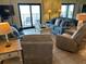 Cozy living room with comfortable seating and large windows boasting natural light at 311 Seascape (Share G), Isle of Palms, SC 29451