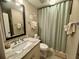 Bathroom showcasing marble countertop, vanity and decorative accents, plus shower curtain at 311 Seascape (Share H), Isle of Palms, SC 29451