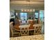 Charming dining area featuring a wooden table, comfortable seating, and natural light from the sliding glass doors at 311 Seascape (Share H), Isle of Palms, SC 29451