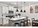 Modern kitchen with white cabinets, a center island, and stainless steel appliances at 328 Surfbird Rd, Summerville, SC 29486