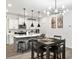 Open kitchen and dining room with modern lighting and stainless steel appliances at 328 Surfbird Rd, Summerville, SC 29486