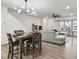 Open-concept living room featuring hardwood floors, a ceiling fan, and lots of natural light at 328 Surfbird Rd, Summerville, SC 29486