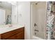 Bathroom featuring a tub, shower, wood vanity, white countertop, toilet and decorative shower curtain at 3807 Canary Ct, North Charleston, SC 29420