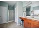 Bathroom with wood vanity, walk-in shower, and tile flooring for a modern feel at 3807 Canary Ct, North Charleston, SC 29420