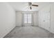 This bedroom features white walls, carpeted floors, a window with blinds and double door closet at 3807 Canary Ct, North Charleston, SC 29420