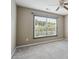 Bright bedroom with neutral walls, ceiling fan, large window, and carpeted floors at 3807 Canary Ct, North Charleston, SC 29420
