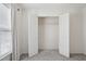 A walk in closet with an open door, shelving, carpeted floors and white walls at 3807 Canary Ct, North Charleston, SC 29420