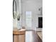 Entryway with dark hardwood floors, a decorative table, fireplace, plants and natural light at 3807 Canary Ct, North Charleston, SC 29420