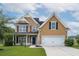 Charming two-story home featuring a well-maintained lawn, attached two-car garage, and inviting front porch at 3807 Canary Ct, North Charleston, SC 29420