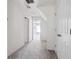 View of a white hallway with carpeted floor, white walls, and doors leading to other rooms at 3807 Canary Ct, North Charleston, SC 29420