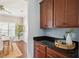Convenient kitchen with wood cabinets and an open view to dining area at 3807 Canary Ct, North Charleston, SC 29420