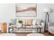 Bright living room features neutral furnishings, a glass coffee table, and stylish decor at 3807 Canary Ct, North Charleston, SC 29420