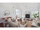 Open living room showcases a fireplace, wood floors, and comfortable seating at 3807 Canary Ct, North Charleston, SC 29420