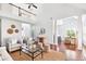 Spacious living area with high ceilings, hardwood floors, and an open floor plan at 3807 Canary Ct, North Charleston, SC 29420
