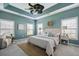 Serene main bedroom features tray ceilings, ample natural light, and plush decor at 3807 Canary Ct, North Charleston, SC 29420