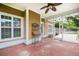 Covered outdoor patio features a ceiling fan for air circulation and a view to the green backyard at 3807 Canary Ct, North Charleston, SC 29420