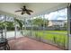 Screened-in patio area offers a view of the fenced in back yard and blue skies at 3807 Canary Ct, North Charleston, SC 29420