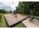 Community playground featuring a slide, spring riders, and benches for entertainment at 3807 Canary Ct, North Charleston, SC 29420
