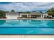 Community pool featuring a swimming pool with lane markers and a seating area at 3807 Canary Ct, North Charleston, SC 29420