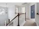 Bright staircase with white railings and a view of the foyer and upstairs hallway at 3807 Canary Ct, North Charleston, SC 29420