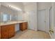 Bathroom with double sinks, vanity, large mirror, and separate shower at 3872 James Bay Road, Johns Island, SC 29455