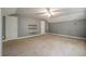 Bedroom with neutral carpet, ceiling fan, two doors, and shelves at 3872 James Bay Road, Johns Island, SC 29455