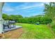 Spacious backyard featuring a grill, firepit, and play area for outdoor entertainment at 401 Felders Ln, Johns Island, SC 29455