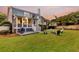 Beautiful backyard with a firepit surrounded by chairs, ideal for outdoor gatherings at 401 Felders Ln, Johns Island, SC 29455
