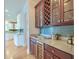 Bar area features a beverage fridge, wine racks, storage, and granite countertops at 401 Felders Ln, Johns Island, SC 29455