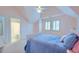 Light and airy bedroom with a blue quilt, ceiling fan, and an ensuite bathroom at 401 Felders Ln, Johns Island, SC 29455