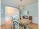 Stylish dining room featuring a modern chandelier and light blue walls at 401 Felders Ln, Johns Island, SC 29455