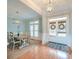 Bright foyer and dining area showcasing hardwood floors, modern lighting, and stylish decor at 401 Felders Ln, Johns Island, SC 29455