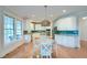Eat in kitchen with white cabinets, stainless appliances, and green subway tile backsplash at 401 Felders Ln, Johns Island, SC 29455
