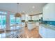 Bright kitchen featuring white cabinetry, an island, stainless appliances, and a breakfast nook at 401 Felders Ln, Johns Island, SC 29455