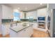 Modern kitchen with white cabinets, stainless steel appliances, and a center island at 401 Felders Ln, Johns Island, SC 29455