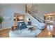 Spacious living room with staircase, fireplace, and open view of the kitchen at 401 Felders Ln, Johns Island, SC 29455