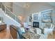 Spacious living room with a fireplace, built-in shelving, and a staircase at 401 Felders Ln, Johns Island, SC 29455