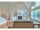 Bright living room with fireplace, built-in shelving, and tall ceilings at 401 Felders Ln, Johns Island, SC 29455