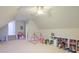 Spacious playroom with vaulted ceilings, ceiling fan, and ample natural light at 401 Felders Ln, Johns Island, SC 29455