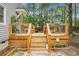 Wooden deck featuring steps and a seating area, complemented by mature trees, and a serene backyard setting at 427 Grape Arbor Drive Dr, Summerville, SC 29486