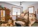 Bedroom with a floral quilt, wooden furniture, chair and carpet at 427 Grape Arbor Drive Dr, Summerville, SC 29486